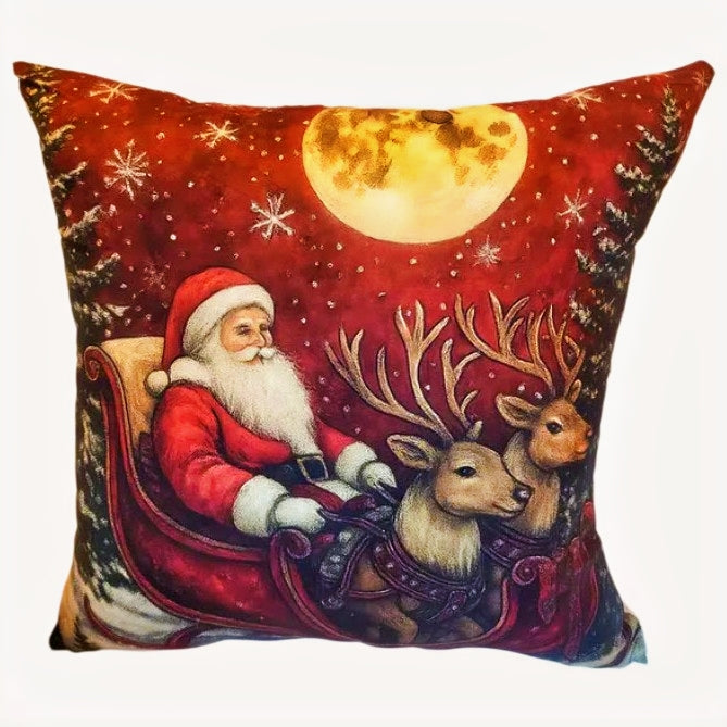 Decorative pillow with Santa Claus and reindeer design against a night sky with moon and stars.