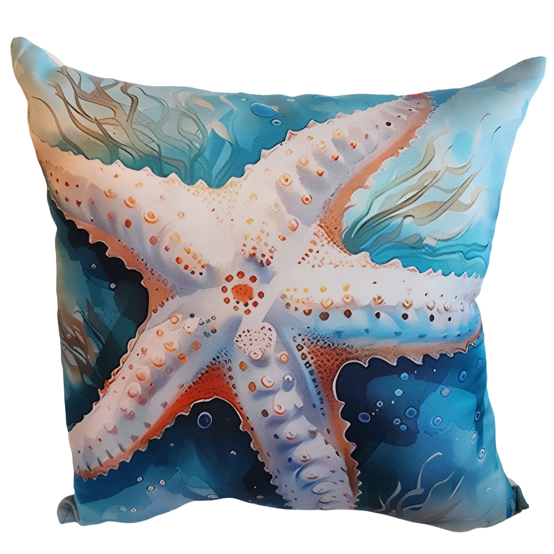 Decorative pillow with a starfish design on a blue ocean background