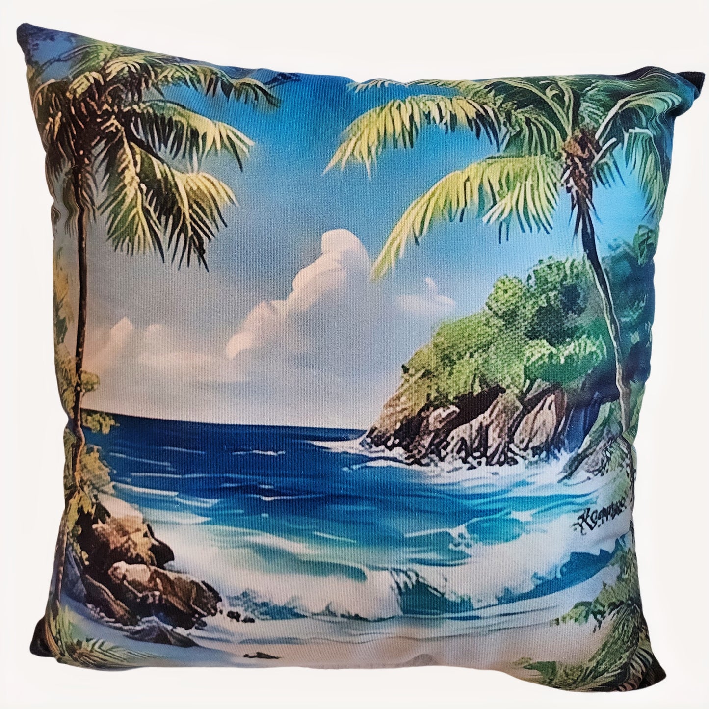 Pillow with a tropical beach scene featuring palm trees and ocean.