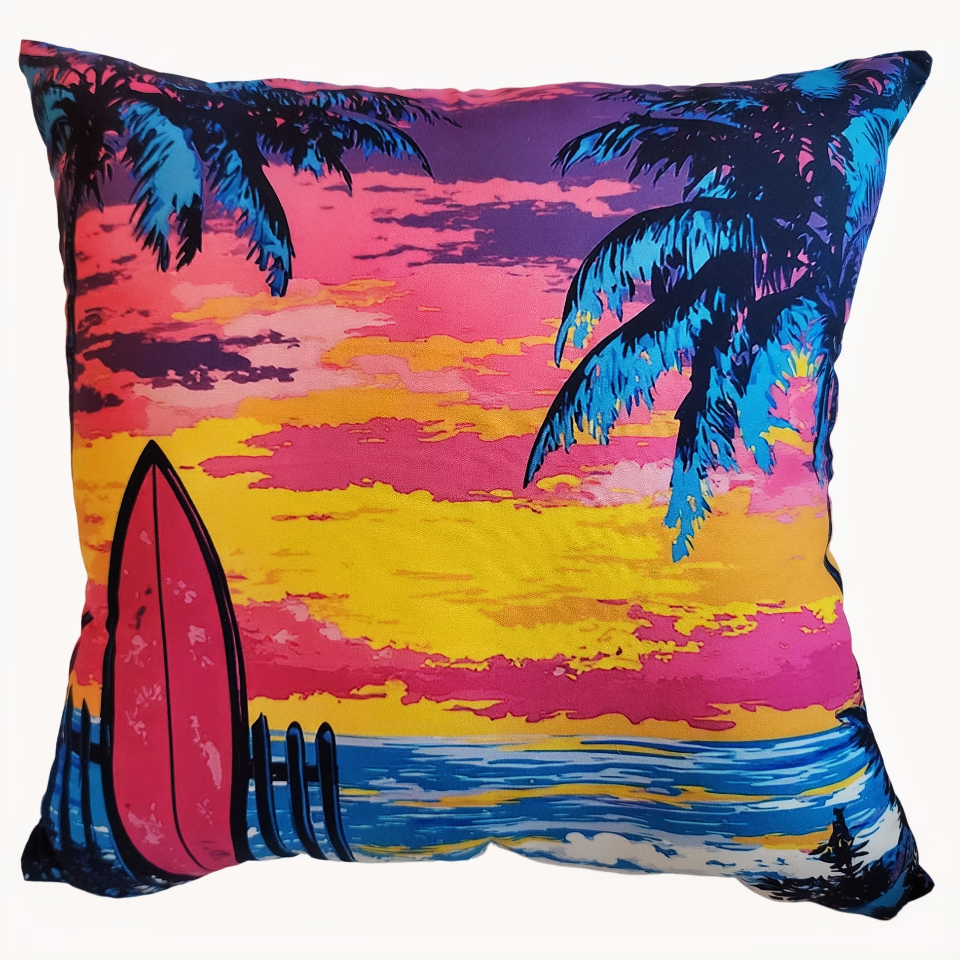 Decorative pillow with a tropical design featuring palm trees, a sunset, and a surfboard.