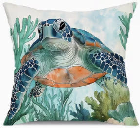 Decorative pillow with a turtle and underwater scene design.
